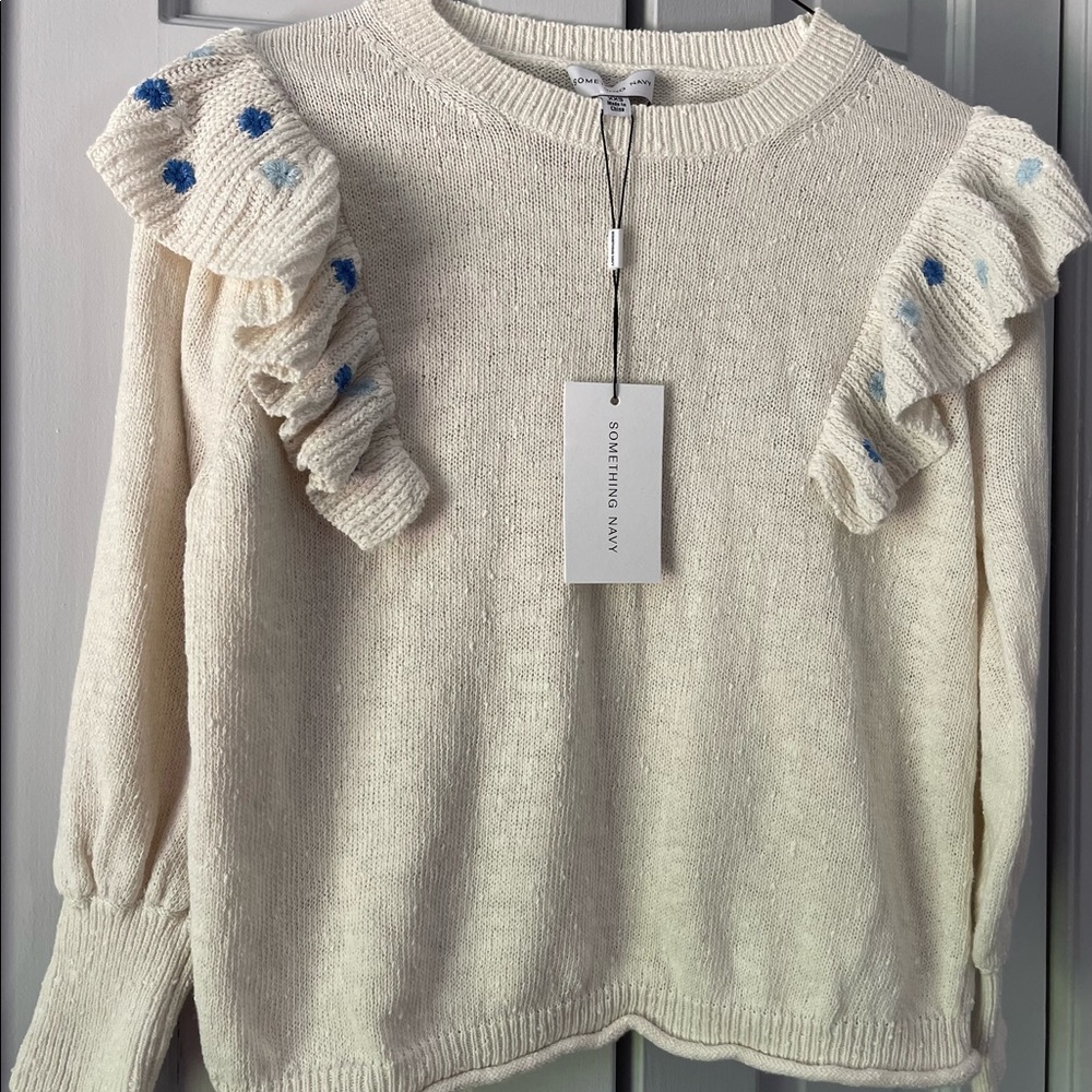 Brand new, with tags, white Something Navy sweater with ruffle, size XXS.